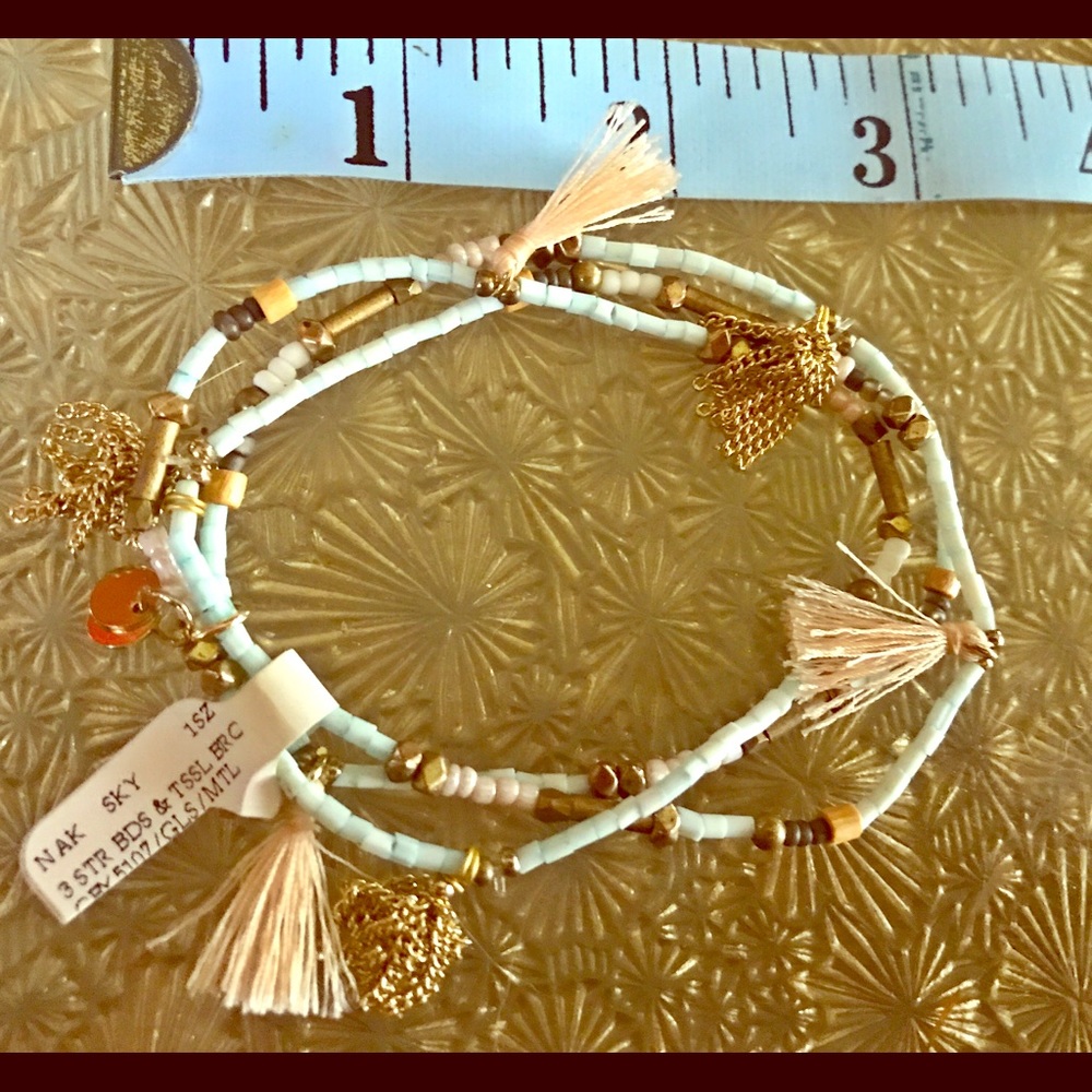 Beaded bracelet with tiny tassels